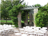 Chairs and flowers are placed in the courtyard for a wedding ceremony