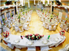 The reception hall is decorated in flowers and streamers for a wedding