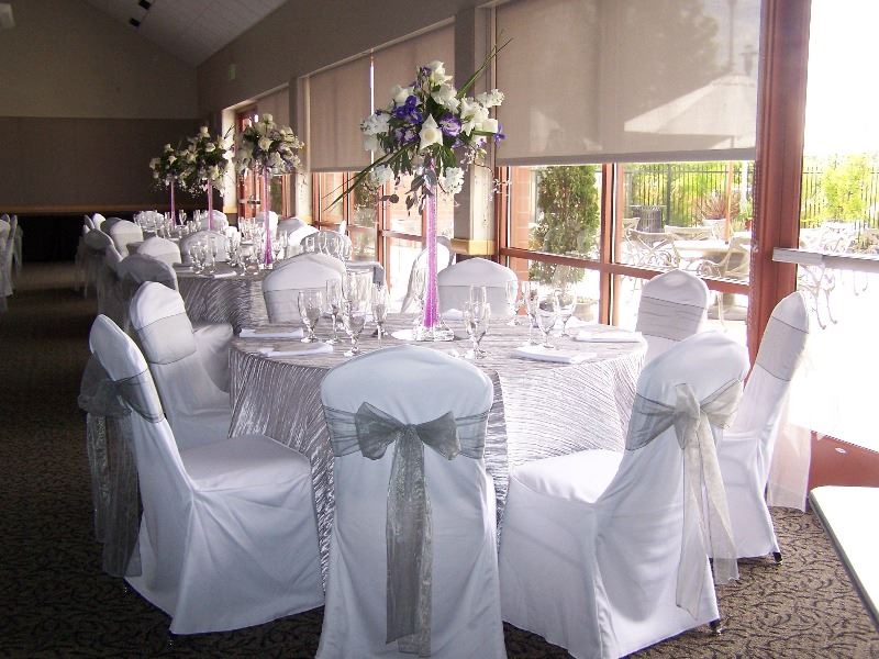 The ballroom is decorated for a wedding reception