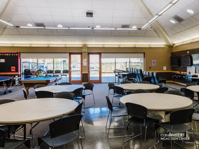 Image of Cosumnes CSD WCAC, Teen Center. Room with chairs and tables, billiard table and TV.
