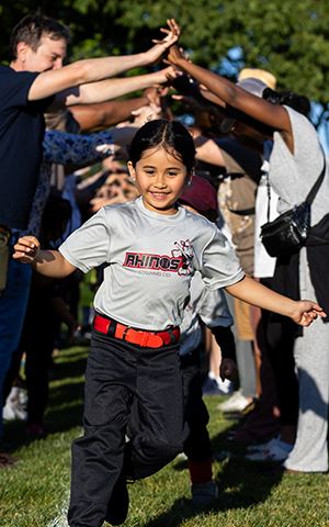 Young girl in T-ball jersey