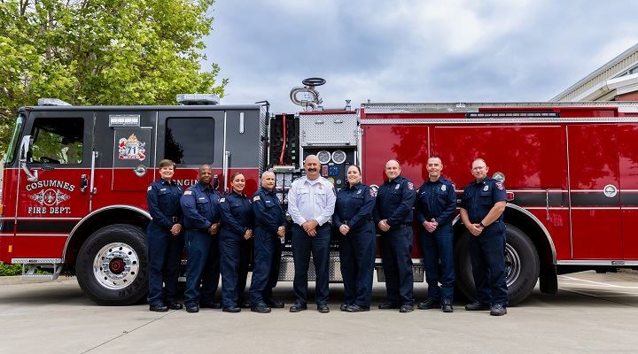 Fire Marshal, Deputy Fire Marshal, and Inspectors standing in front of Engine 71