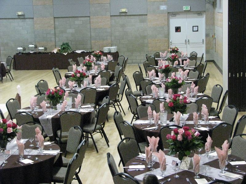 Room is set up for a meeting with tables and chairs