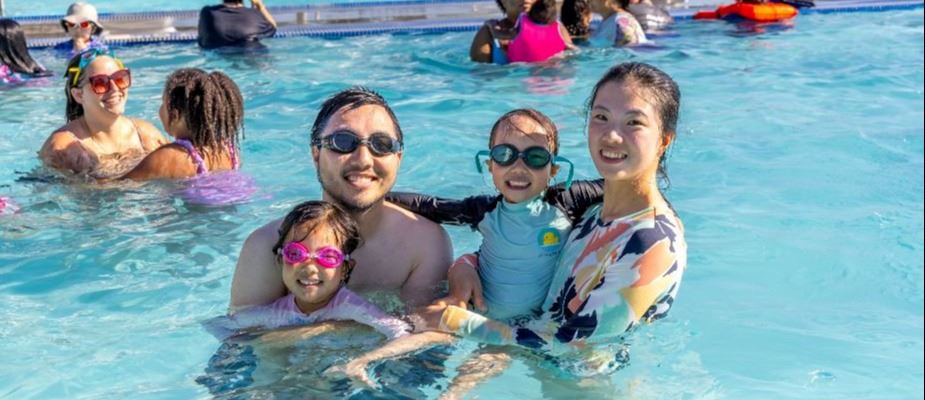 A family enjoying the pool during the dive in movie