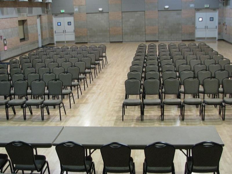 The hall is set up for a lecture.