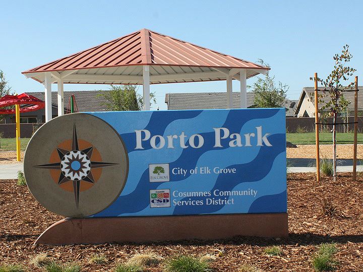 Park Sign with a compass design on the left, and blue wave background