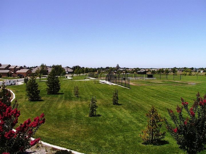 A view of the expansive lawn and baseball field at Jones Park